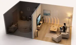 Habitación de bebé tranquila gracias a la insonorización. En la sala, una pareja disfruta del entretenimiento sin molestar.