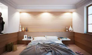 Ideas para distribuir un dormitorio de matrimonio: cama central, mesitas flotantes, nicho con Buda y decoración minimalista.