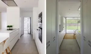 Cocina alargada blanca con encimeras y armarios modernos. Ideas para distribuir una cocina alargada de forma funcional y estilosa.