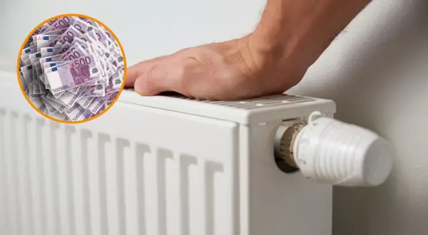 Un radiador blanco con un termostato y un círculo de billetes de 500 euros. Es bueno apagar la caldera por la noche para ahorrar dinero.