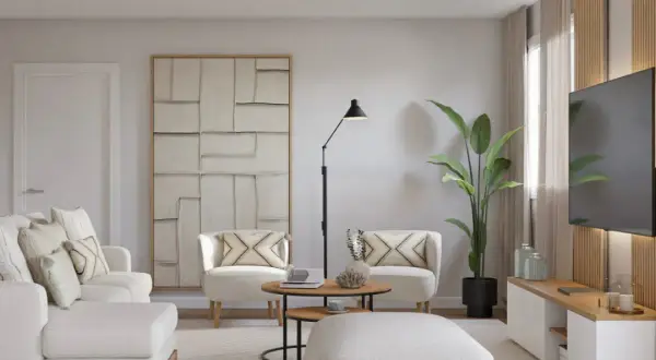 Un salón moderno y luminoso, ideal para aprender como decorar un salón con muebles blancos. Sofá, sillones y pouf blancos, con detalles en madera y arte abstracto.
