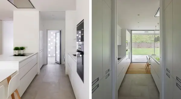 Cocina alargada blanca con encimeras y armarios modernos. Ideas para distribuir una cocina alargada de forma funcional y estilosa.