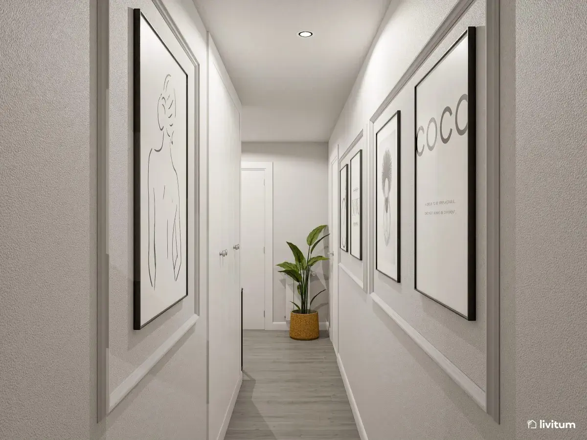 Pasillos decorados con arte minimalista y una planta verde, creando un ambiente moderno y acogedor.