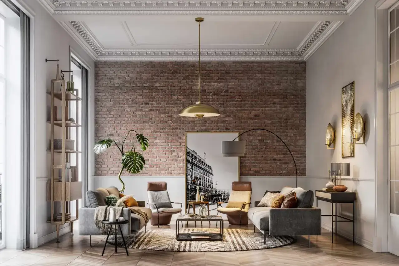 Salón moderno con una imponente pared de ladrillo visto, sofás grises, sillones de cuero y una planta exuberante.