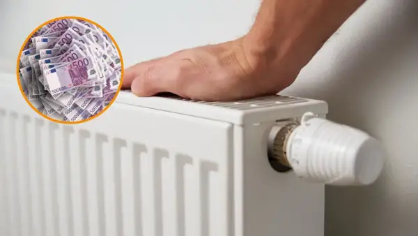 Un radiador blanco con un termostato y un círculo de billetes de 500 euros. Es bueno apagar la caldera por la noche para ahorrar dinero.
