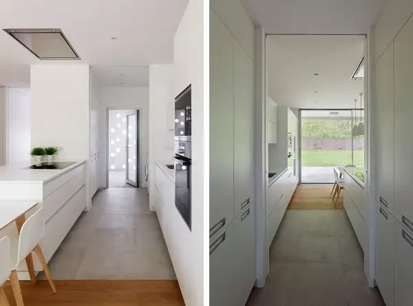 Cocina alargada blanca con encimeras y armarios modernos. Ideas para distribuir una cocina alargada de forma funcional y estilosa.